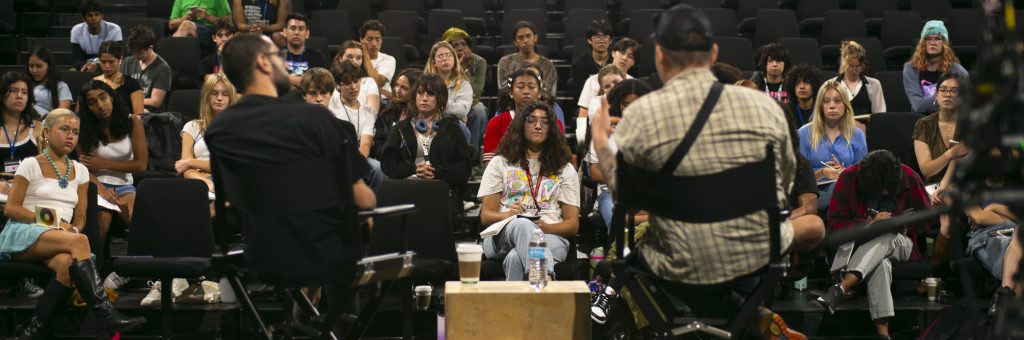 Film Chair Pietro Pinto moderating a masterclass in front of a theater of students